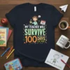 My Teacher Will Survive 100 Days of Me t-shirt with colorful text and cartoon teacher graphic