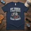 My Truck Is Much Bigger Than Yours t-shirt with a large semi-truck crushing a small red car