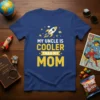My Uncle Is Cooler Than My Mom text design with a rocket graphic, yellow stars and planets