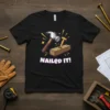 Nailed It! text with cartoon hammer and nail in wood on black t-shirt design