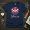 Navy blue t-shirt with a pink and white lotus mandala design and the word "Namaste" printed in pink