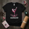 Black t-shirt featuring the word "Namaste" in white text with a pink yoga dancer pose above it