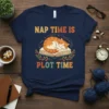 Nap Time Is Plot Time t-shirt with a sleeping cat on an open book, vintage style typography