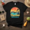 Nassau Bahamas text with a scenic cruise ship and city skyline design on a black t-shirt