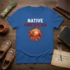 Native Amerikan t-shirt with bold white and red text and a circular desert sunset graphic featuring cacti and tribal patterns