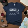 Native Massachusetts T-Shirt with state outline, lighthouse, sailboat, and local icons in white on a navy blue tee