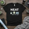 Black t-shirt with the word "NEAT" and a graphic of a tidy desk setup including a laptop, plant, and sticky