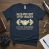 Navy t-shirt with "Need Prayer? Tap My Shoulder" and Matthew 18:20 Bible verse, featuring a handshake on a dumbbell graphic