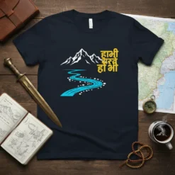 T-shirt with "हामी सधैं हो भि" in yellow Nepali text, alongside a stylized mountain and blue river graphic