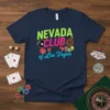 Nevada Club of Las Vegas t-shirt with neon text, playing cards, dice, and roulette wheel graphic