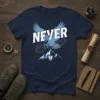 Navy t-shirt with white and blue 'NEVER' text, an eagle breaking chains, and mountain graphics