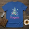 Never too old for Fairytales quote with a whimsical castle and flying fairies graphic on a blue t-shirt