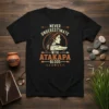 Never Underestimate With Atakapa Blood t-shirt featuring a woman and alligator graphic, celebrating indigenous heritage