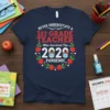 Never Underestimate A 1st Grade Teacher Who Survived The 2020 Pandemic t-shirt with red and white text and apple graphics