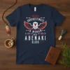 Navy t-shirt with bold white text "Never Underestimate A Woman With Abenaki Blood" and a stylized eagle graphic