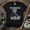Never Underestimate An Old Man With A Hockey Stick t-shirt design featuring a vintage hockey player graphic