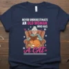 Never Underestimate An Old Woman Who Has A Cat t-shirt featuring a grandma reading with her cat