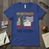 Nevertheless She Voted. She Voted. T-Shirt with silhouette of woman voting and American flag graphic