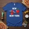 Blue t-shirt with white text "NEW NEW YORK" and a graphic of the Brooklyn Bridge with a red apple