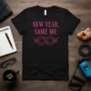Black t-shirt with pink text reading "NEW YEAR, SAME ME" and an infinity symbol graphic