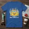 New York City taxi t-shirt featuring a smiling yellow cab, Statue of Liberty, and city skyline graphic. Text reads "I