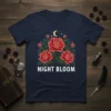 Navy t-shirt featuring the "Night Bloom" text with a graphic of three red roses, buds, leaves, a crescent moon, and