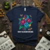 Navy t-shirt with "Night Blossom Dreams" text and a colorful floral bouquet with butterflies and moths