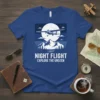 Night Flight Explore The Unseen t-shirt design featuring a silhouette of a small airplane flying over mountains under a full
