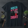 Ninja In Plain Sight t-shirt design with a ninja drinking tea next to pink flowers