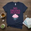 Navy blue t-shirt with pink text "NO DRAMA PLEASE" above a pink cloud with blue lightning and hearts