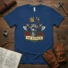 T-shirt design with the text "NO KINGS" in a banner, a knight's gauntlet, crossed axes, red roses, and a broken