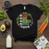 Black t-shirt with "NO MEAT NO PAIN NO TORTURE NO SHAME Vegan" text in colorful lettering, surrounded by a leafy