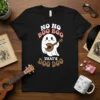 Black t-shirt with "NO NO BOO BOO THAT'S DOO DOO" text and a cute ghost playing a ukulele graphic
