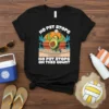 Black t-shirt with "No Pit Stops On This Court" text and a muscular avocado playing volleyball, set against a beach