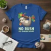Sloth hanging on a branch with "No Rush Just Hanging Around" text, tropical flowers, blue t-shirt