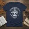 Navy t-shirt with white text "No Weapon Formed Prosper Day Forty One Against Me Isaiah 54:17" and a graphic of