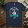 No Wise Man Ever Wished To Be Younger quote with ancient philosopher graphic and birthday cake on navy t-shirt
