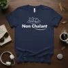 Navy blue t-shirt with white text "Non Chalant" and a sleeping cat graphic on a cloud
