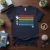 Nonagressive text in rainbow colors on a navy t-shirt, with a dove and olive branch graphic