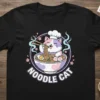 Noodle Cat graphic t-shirt featuring a cute cat chef eating ramen noodles with chopsticks