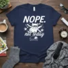 Nope Not Today funny cat t-shirt design with a cool cat lounging on a couch, surrounded by clocks and phone
