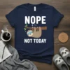 Nope Not Today Sloth T-Shirt with a sleepy sloth hanging from a branch, Zzz text, and white typography