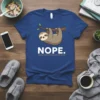 Nope Sloth T-Shirt with a cute sloth hanging from a branch and the word "NOPE." printed below