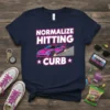 Normalize Hitting Curb text with a pink sports car graphic on a navy t-shirt