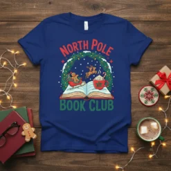 North Pole Book Club text with gingerbread man in sleigh and reindeer graphic on a blue t-shirt