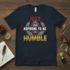 Not Aspiring To Be Humble quote t-shirt with a crowned lion graphic and laurel wreath