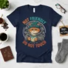 Navy t-shirt with "Not Friendly Do Not Touch" text and a grumpy cat holding a coffee mug, wearing a beanie