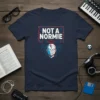 Graphic tee with "NOT A NORM!E" text and a geometric robot head design, featuring binary code elements