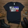 Navy blue t-shirt with white text "NOT A TASERS KIND OF GIRL" and red, white, blue American flag elements