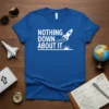 Nothing Down About It quote with a rocket launching and sun graphic on a blue t-shirt